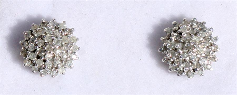 A pair of 9ct gold diamond cluster earrings.