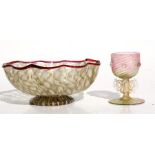 A Venetian gold flecked glass bowl, 14cms (5.5ins) diameter; together with a similar liquor glass,