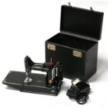 A Singer Featherweight portable sewing machine, model '221K' (CAK6-12), in original case.