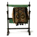 A Victorian faux rosewood tapestry loom, on bobbin turned supports, 71cms (28ins) wide.