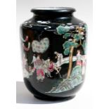 A Chinese famille noire vase decorated with figures in a landscape, red seal mark to underside (