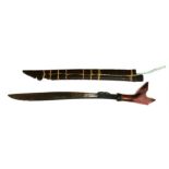 A Malaysian Parang in its wooden scabbard. Blade length 50cms (19.75ins)