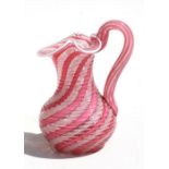 A Venetian pink glass jug with ground out pontil mark to base, 9cms (3.5ins) high. Condition