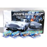 A boxed set of James Bond 007 Scalextric; together with four boxed Scalextric slot cars - Dodge