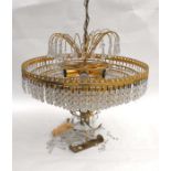 A eight- tier circular ceiling light with crystal drops; together with a similar wall light (2).