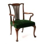 A Georgian mahogany elbow chair with upholstered seat, on cabriole front supports. Condition