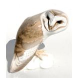 A Bing & Grondahl figure in the form of a barn owl perched on a rock, model no. 1683, designed by