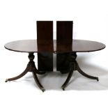 A 19th century mahogany 'D' end twin pedestal dining table with two extra leaves, 255cms (101.