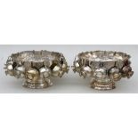 Two silver plated punch bowls and cups, 32cms (12.5) diameter.