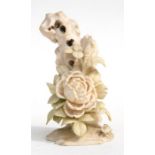An early 20th century Chinese ivory carving in the form of a flower and a rock, 17.5cms (7ins)