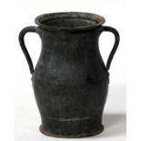 An Eastern two-handled vase with incised foliate decoration, 30cms (11.75ins) high.