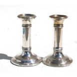 A pair of Edwardian loaded silver candlesticks, Birmingham 1905, 14cms (5.5ins) high.