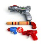 Three assorted plastic Space Guns and a wooden Pop Gun