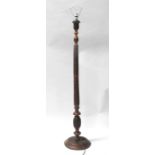 An Indian carved hardwood standard lamp.