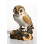 A Royal Crown Derby figure of a barn owl perched on a tree stump, 15cms (6ins) high.