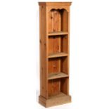 A modern pine narrow open bookcase, 36cms (14ins) wide.
