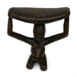 An African figural carved head rest, 17cms (6.75ins) high.