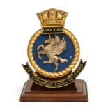A mounted hand painted bronze ships crest to the WW2 light aircraft carrier & aircraft repair ship