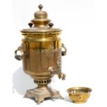 A Russian brass samovar with impressed competition medallions, 53cms (21ins) high.