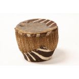 An African Zulu zebra skin drum, 33cms (13ins) diameter.