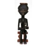 An Ashanti wooden maternity figure, 54cms (21.25ins) high.