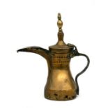 A Turkish / Islamic brass dallah coffee pot, 33cms (13ins) high.