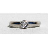 An 18ct white gold and diamond solitaire ring, approx UK size 'L'.