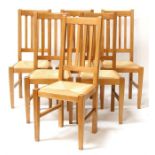 A set of six oak rush seated dining chairs.