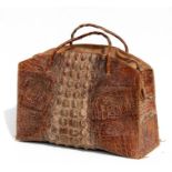 A crocodile skin bag, 49cms (19.25ins) wide.