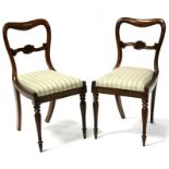 A pair of Victorian rosewood dining chair with upholstered seats