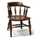 A 19th century smokers bow elbow chair.