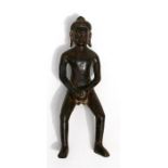 A South East Asian bronze figure depicting a monk holding his phallus, 15cms (6ins) high.