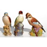 A Beswick kestrel, model no. 2316; a Royal Worcester Jay and a Royal Worcester woodpecker (3).