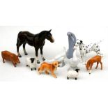 A Beswick foal; two Beswick sheep; a Royal Doulton pig; two Nao geese; and other figures.