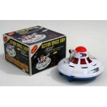 A boxed battery operated Action Space Ship. The box bearing the Woolbro registered trademark. Made