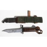 An AKM knife bayonet and wire cutting scabbard, 34cms (13.25ins) long.