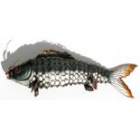 A Chinese enamel articulated carp fish, 15cms (6ins) long.