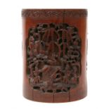 A Chinese bamboo brush pot, deeply carved with animals, birds and figures in a landscape, 17cms (6.