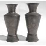 A pair of Cairo ware vases, decorated deer with silver inlay, 14cms (5.5ins) high.