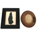 A 19th century three-quarter length portrait silhouette, framed & glazed, 10 by 15cms (4 by 6ins);