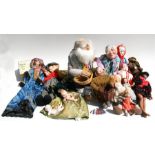 A large quantity of dolls and figures, mainly in National costumes, to include Russian dolls,
