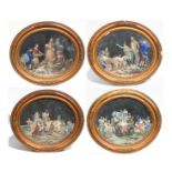 A set of four 19th century hand coloured oval prints depicting gypsies and hunting scenes, 45 by