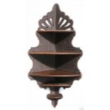 A carved oak five-tier corner shelf, 106cms (41.75ins) high.