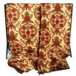 A pair of Baker Print curtains decorated with flowers on a gold ground.293cm by 254cm (115 by