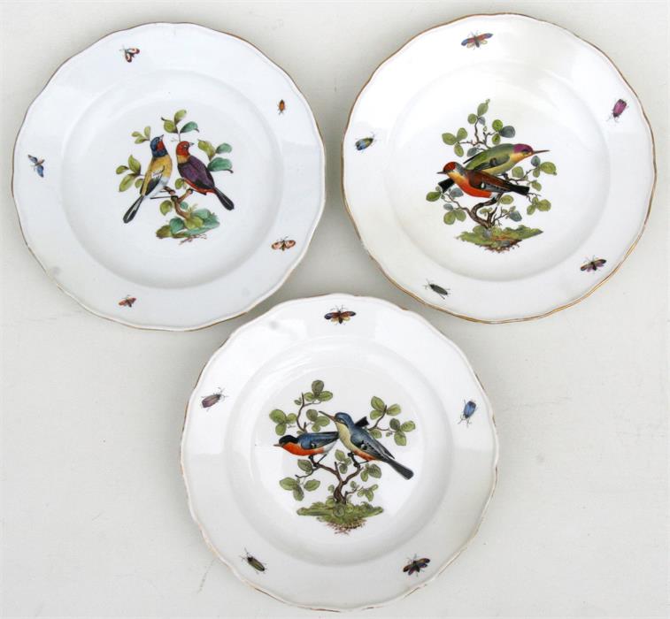 Three 19th century Meissen plates decorated with birds and insects, with blue crossed swords marks