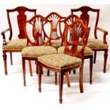 A set of four mahogany dining chairs with pierced wheatsheaf splats, on square tapering legs;