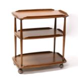 An Ercol three-tier hostess trolley, 72cms (28.25ins) wide.