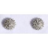 A pair of 9ct gold diamond cluster earrings.