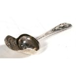 A Georgian silver caddy spoon, the handle decorated with a dancing girl, 9.5cm (3.75ins) high.