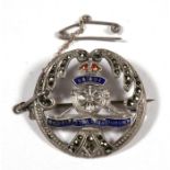 A silver and marcasite Royal Artillery sweetheart brooch with safety chain